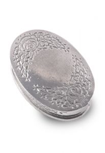 Handgjord oval mini urna i tenn med en blommönster för kremeringsaska