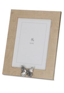 Ljusbrun fotoram urna med silverfärgat fjäril